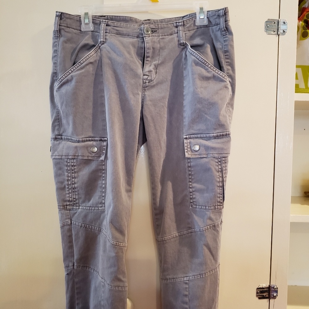 Gray cargo jean material pants with ankle zippers